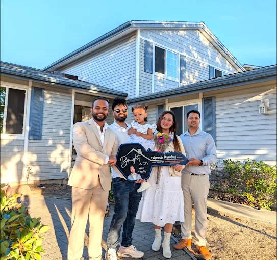 Clients outside their new home after closing